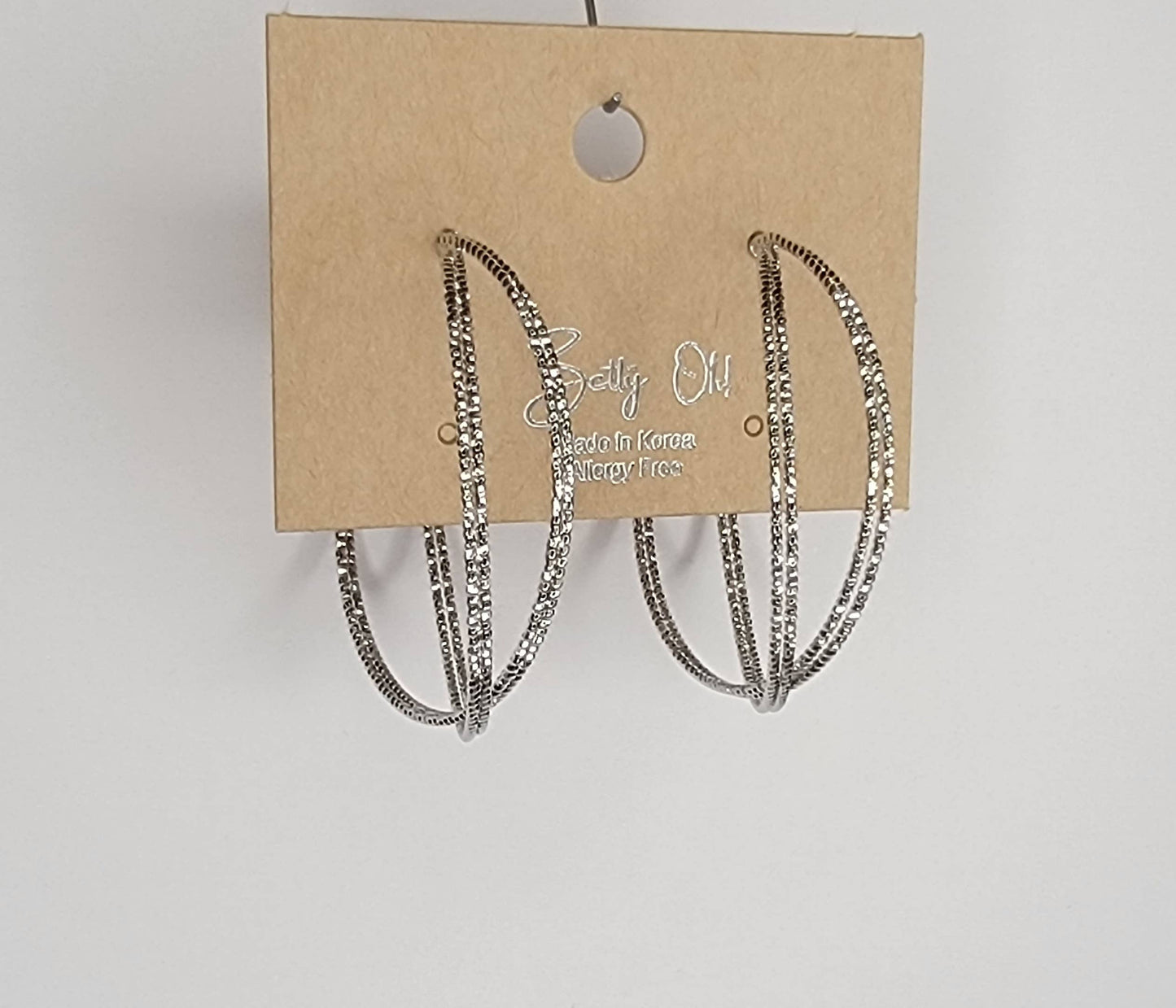 BETTYOH INC - LAZER CUT CRISS CROSS HOOP EARRINGS.