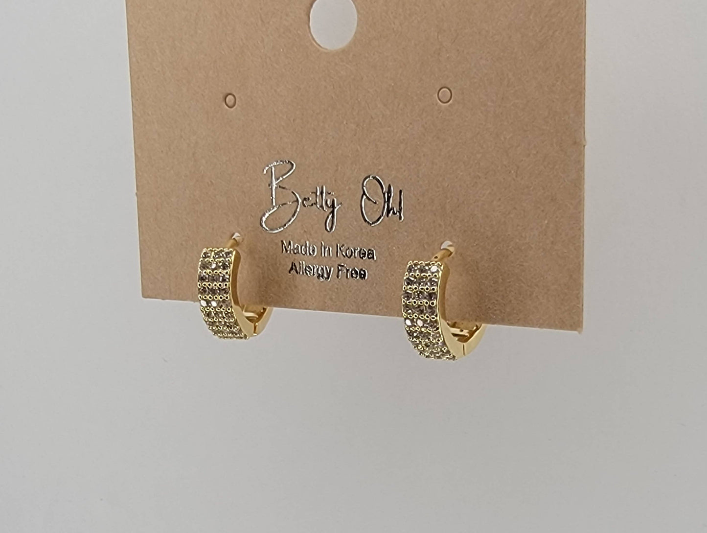 BETTYOH INC - CZ SMALL CLICKER EARRINGS.