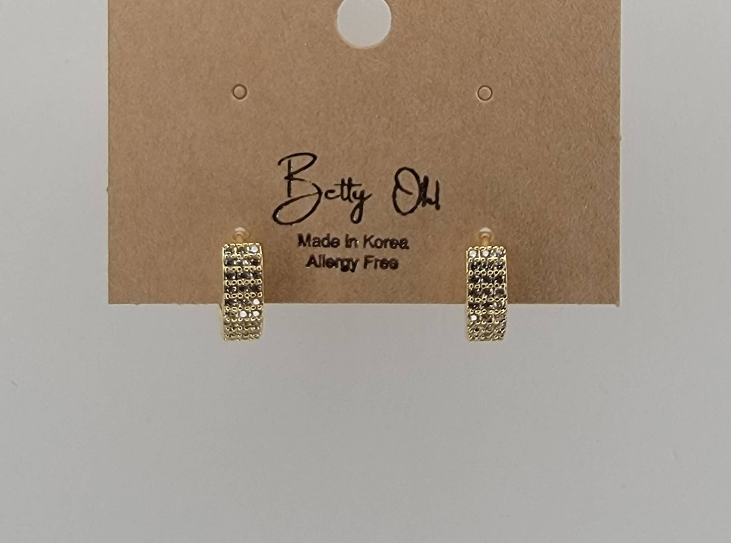 BETTYOH INC - CZ SMALL CLICKER EARRINGS.